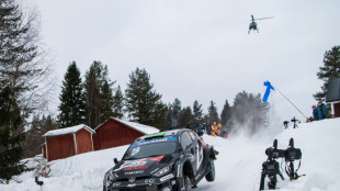 Snow king Evans leads tight race at Rally Sweden
