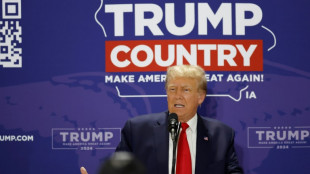 Soaring Trump snubs second Republican debate to meet auto workers