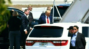 Trump flies to New York to surrender to charges