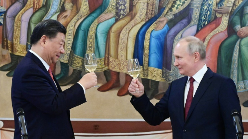 Xi re&ccedil;oit Poutine et salue une relation "propice &agrave; la paix"