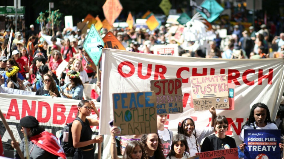Climate protesters throng New York, demand end to fossil fuels 