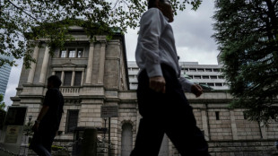 Stock markets retreat after central bank rate hikes