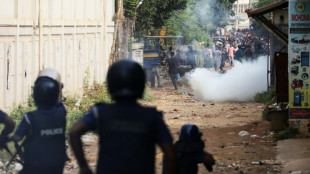 Bangladesh garment workers clash with police as factories reopen
