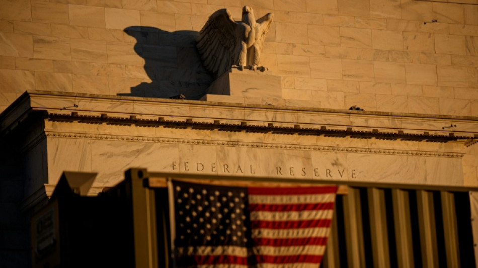 Asian traders cheer US rate cut but gains tempered by outlook