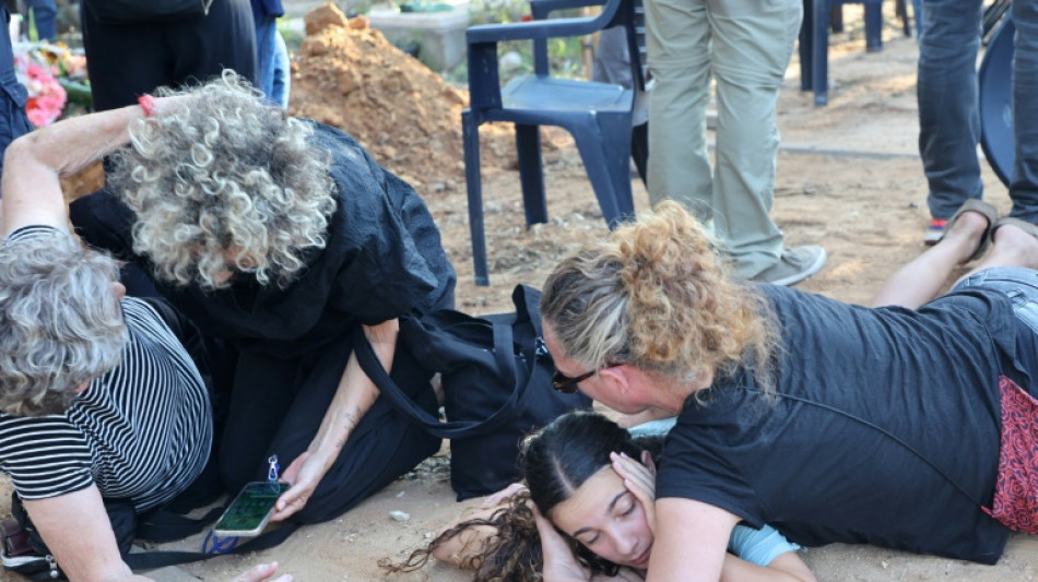 In Israel, a burial under rocket fire and a call to spare Gaza