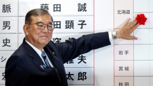Japan PM hangs on after election debacle