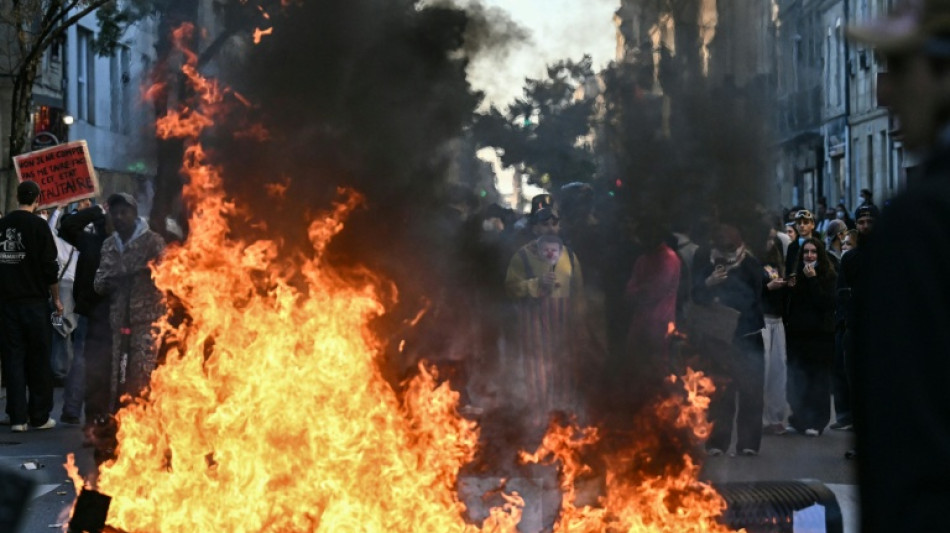 Police fire tear gas as thousands march in France